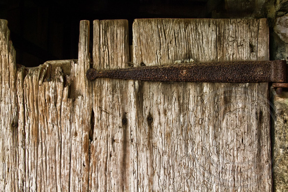 © Kates's Barn #2 Rona Golfen, RonaPhoto a photograph of a rusty hand-made hinge on a broken weathered barn door